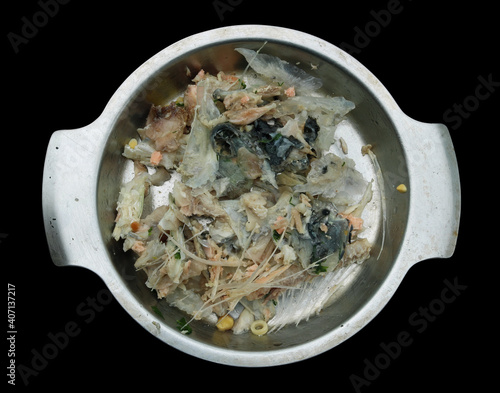 Bones and scraps from boiled fish isolated photo