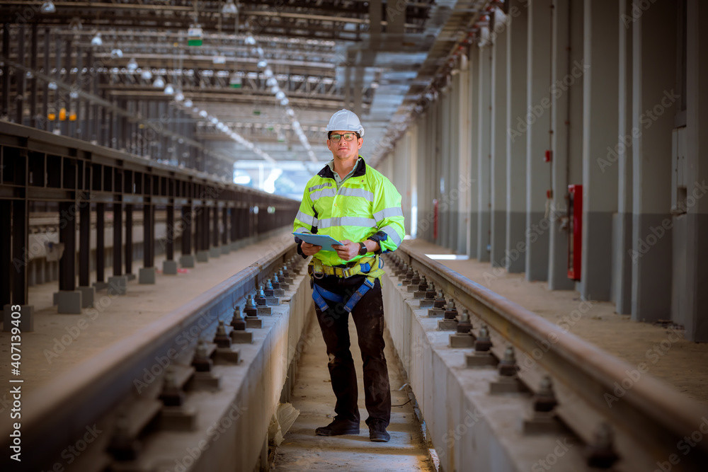 custom made wallpaper toronto digitalEngineer railway under inspection and checking construction process train and railroad station .Engineer wearing safety uniform and helmet by holding document in work.