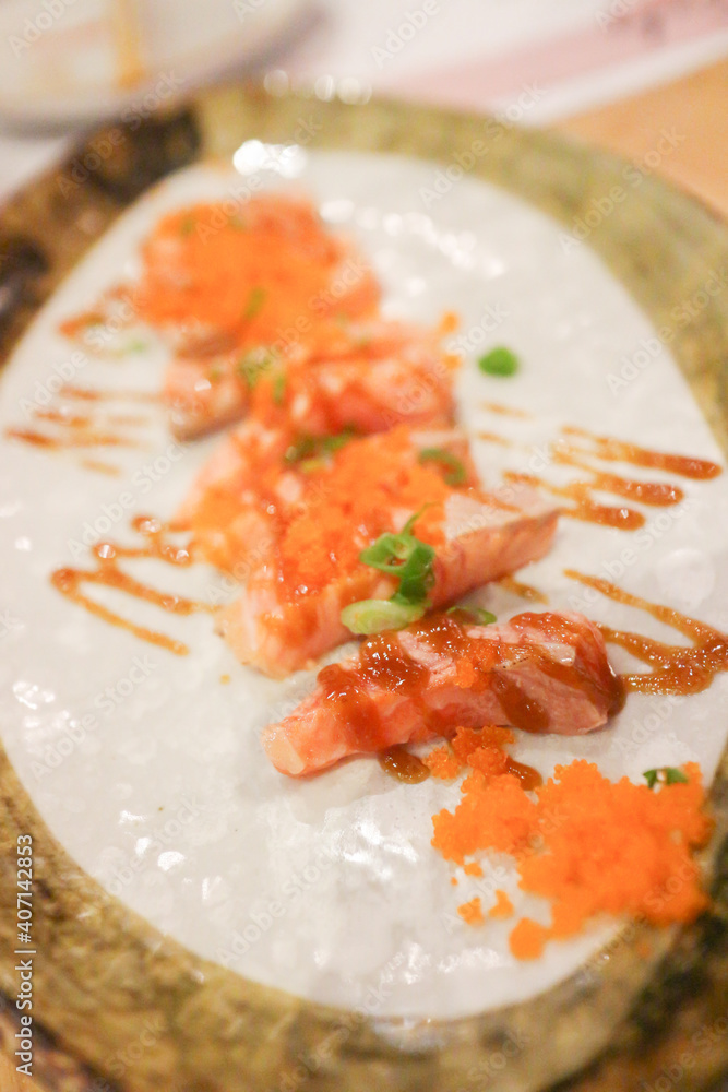 Salmon and sauce on white plate Salmon and sauce on white plate