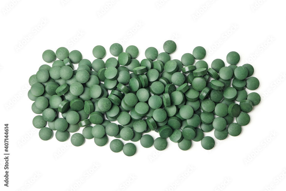Heap of spirulina pills isolated on white background Heap of spirulina pills isolated on white background