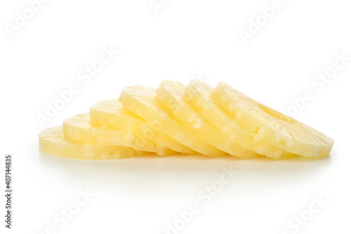 Ripe pineapple slices isolated on white background