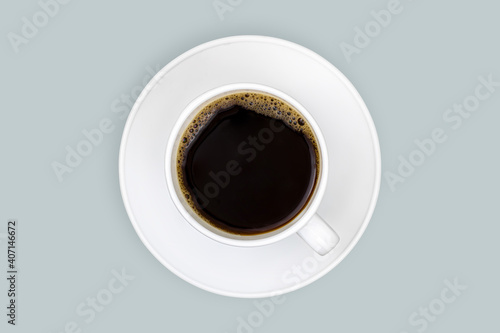 White cups with coffee on a bright colored background.