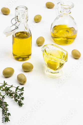 Olives are scattered on table.