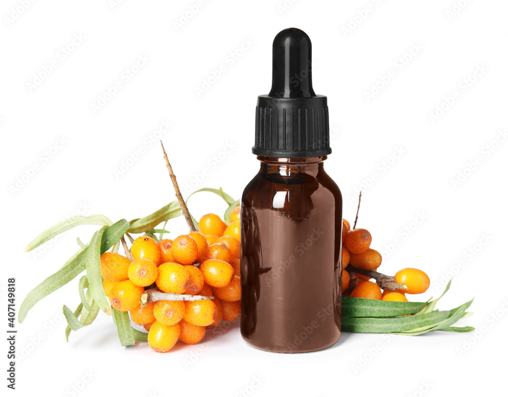 Natural sea buckthorn oil and fresh berries on white background Natural sea buckthorn oil and fresh berries on white background