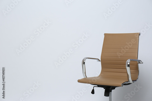 Comfortable office chair on white background, space for text