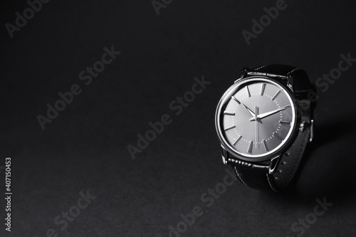 Luxury wrist watch on black background, space for text Fototapeta