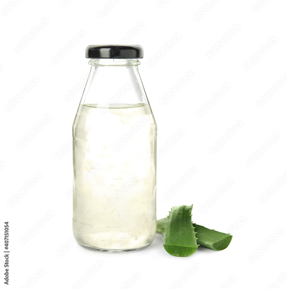 Fresh aloe drink in bottle and leaves on white background