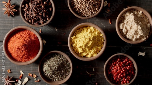 TOP VIEW: Spices and herbs. Variety of colourful seasoning.