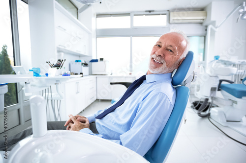 Elderly man in dentist s chair without fear waiting for treatment