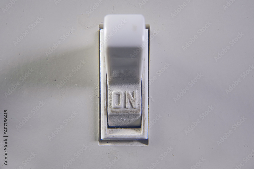Macro Close Up Of A Light Switch Turned To On Macro Close Up Of A Light Switch Turned To On