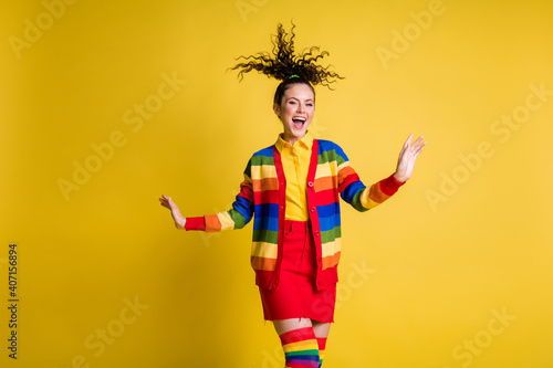 Photo of funky crazy girl air wind hair wear rainbow long socks skirt isolated bright color background