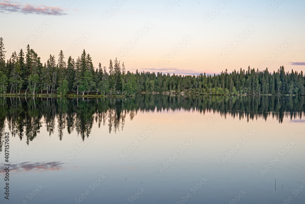 sunset reflection on lake in norway sunset reflection on lake in norway