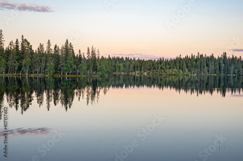 sunset reflection on lake in norway