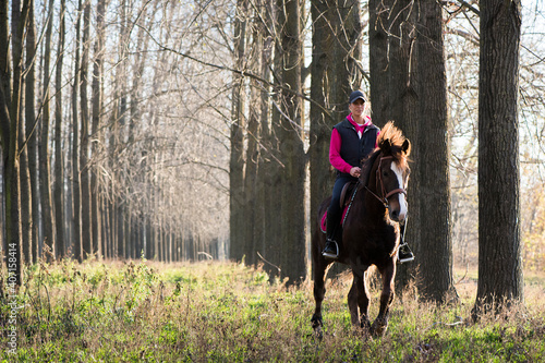  Girl riding a horse © Dusan Kostic