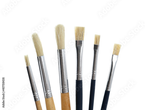 Set of different paint brushes on white background