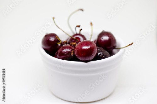Fresh, ripe cherries isolated in white
