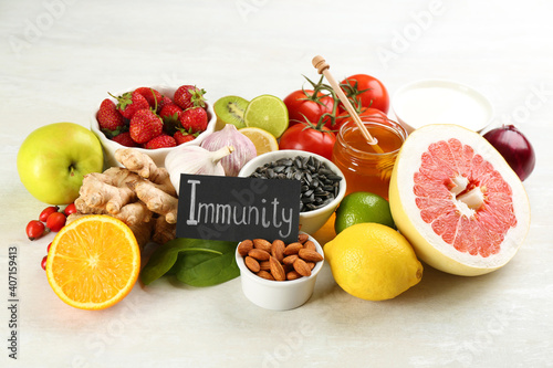 Card with phrase Immunity and fresh products on light table