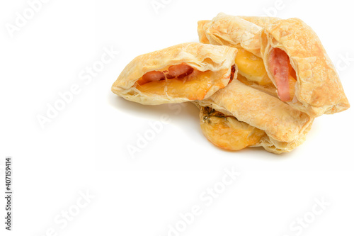 Croissants with melted cheese and ham.Homemade cakes.Healthy breakfast.White isolated background.