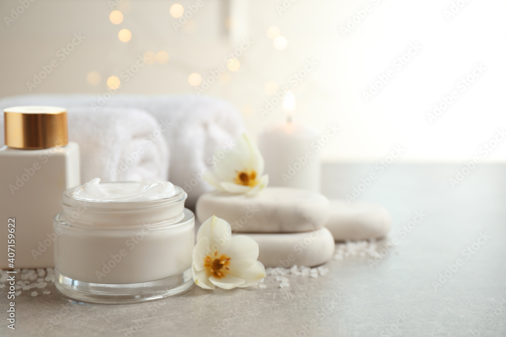 Spa composition with skin care products on light background, space for text