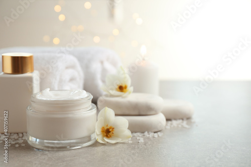 Spa composition with skin care products on light background, space for text