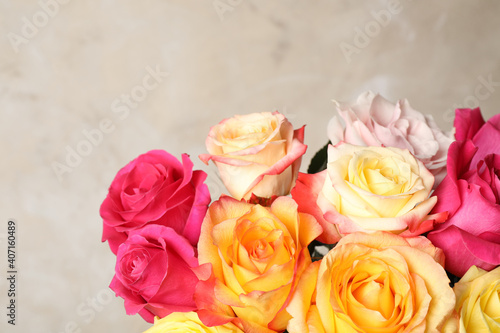 Luxury bouquet of fresh roses on beige background  closeup