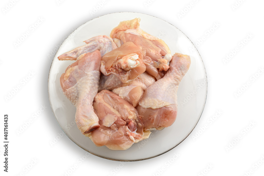 Raw chicken meat on a plate. Isolated on a white background.The view from the top. Healthy eating