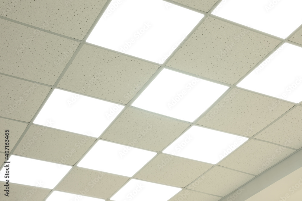 White ceiling with lighting in office room White ceiling with lighting in office room