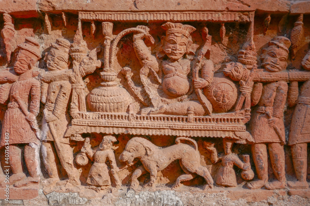 Fototapeta premium Detail of noble man with hookah on litter intricate terracotta carving at Kantaji aka Kantajew medieval hindu temple in Kantanagar, Dinajpur, Bangladesh