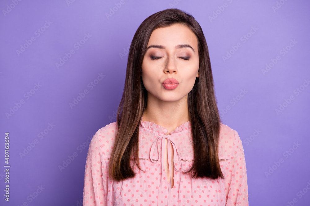 Portrait of nice attractive dreamy girl sending air kiss isolated over bright violet color background Portrait of nice attractive dreamy girl sending air kiss isolated over bright violet color background