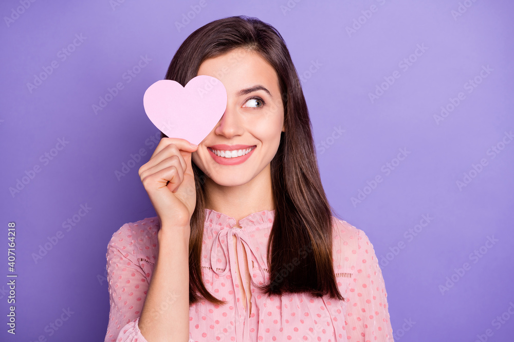 Photo of pretty cheerful person heart paper card cover eye look empty space wear retro isolated on purple color background Photo of pretty cheerful person heart paper card cover eye look empty space wear retro isolated on purple color background