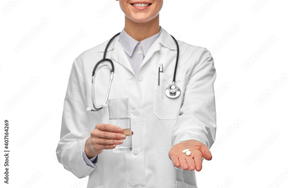medicine, profession and healthcare concept - close up of happy smiling female doctor with pill and glass of water over white background medicine, profession and healthcare concept - close up of happy smiling female doctor with pill and glass of water over white background