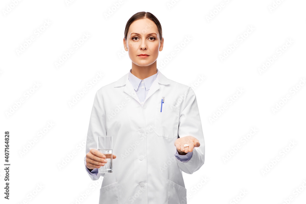 medicine, profession and healthcare concept - female doctor with pill and glass of water over white background medicine, profession and healthcare concept - female doctor with pill and glass of water over white background