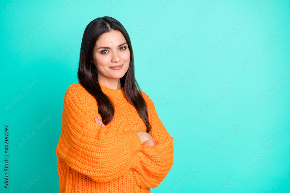 Fototapeta premium Photo of charming mature woman crossed arms look camera wear orange sweater isolated turquoise color background