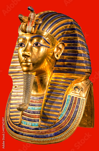 Funeral mask of pharoah Tutankhamun on red background