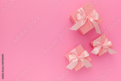 Valentines day composition  three pink gift boxes with ribbon