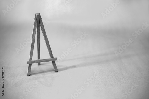 Wooden easel. Black and white picture. background texture.