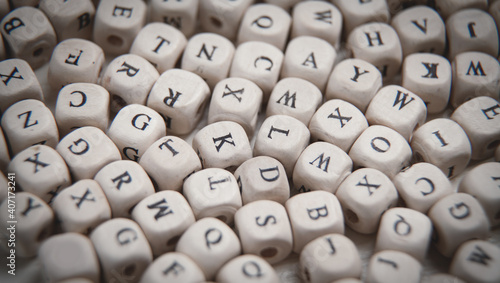 Wooden small cubes with letters.