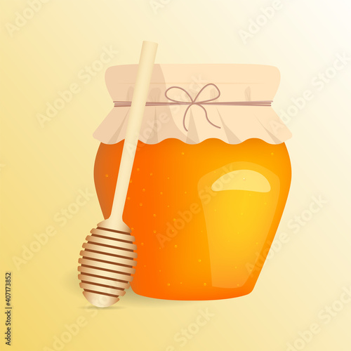 honey in a glass jar and honey spoon