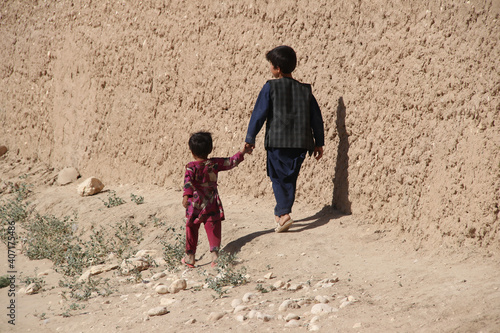 Afghanistan village and school children in the middle of the drought in the North east in the summer of 2019 photo