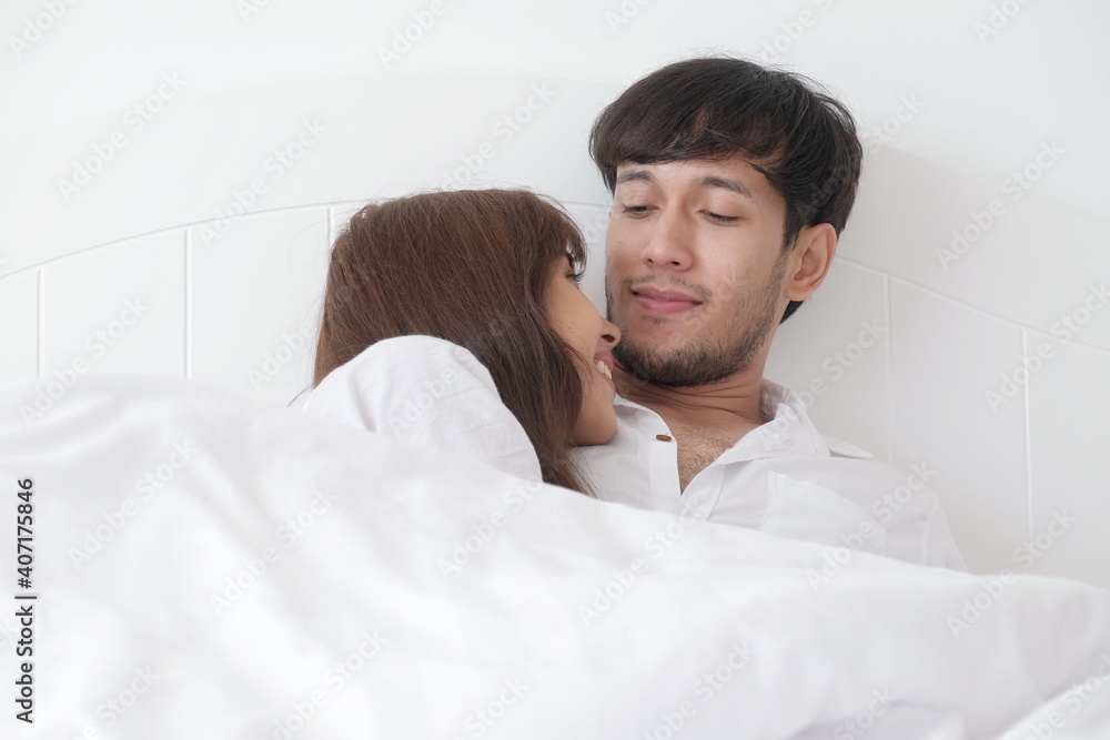 Fototapeta premium Romantic couple in bedroom and living room With activities in the afternoon on a sweet holiday