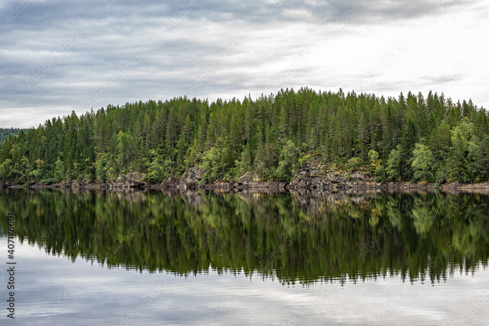 Reflections from a forest in a lake in Norway Reflections from a forest in a lake in Norway