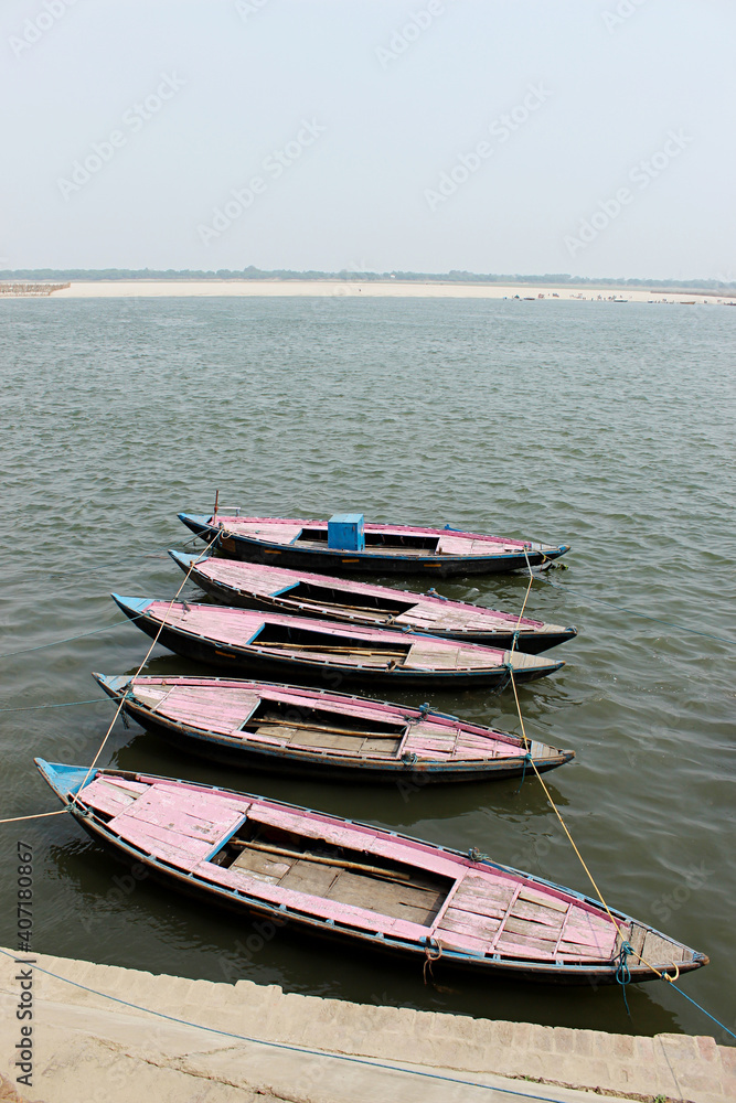 Small wooden boats parked by riverside, Varanasi, Uttar Pradesh, India Small wooden boats parked by riverside, Varanasi, Uttar Pradesh, India