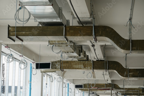 Installation of cold air ducts, air conditioning systems in buildings, priming and insulating inside.