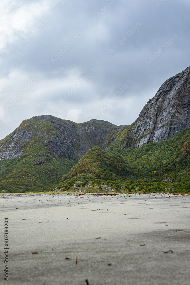 Beach with mountains and strong weather in north Norway