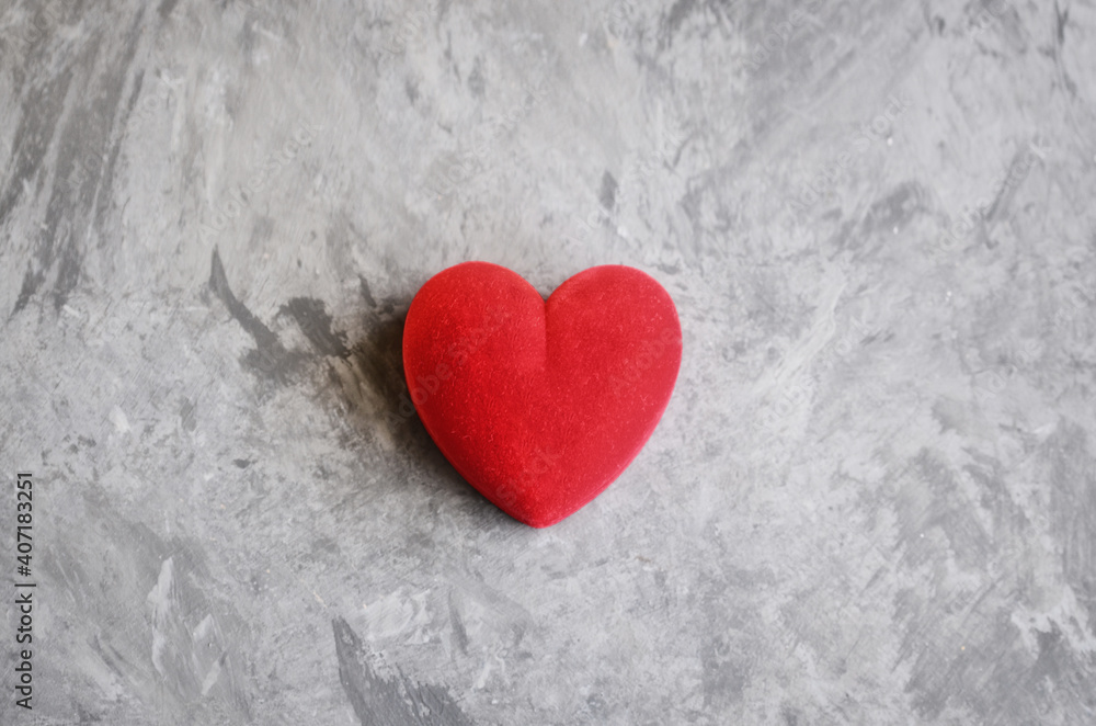 Red heart on concrete background for Saint Valentines day celebration or love concept.Copy space Red heart on concrete background for Saint Valentines day celebration or love concept.Copy space