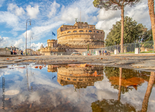 Rome, Italy - in Winter time, frequent rain showers create pools in which the wonderful Old Town of Rome reflect like in a mirror. Here in particular Castel Sant'Angelo