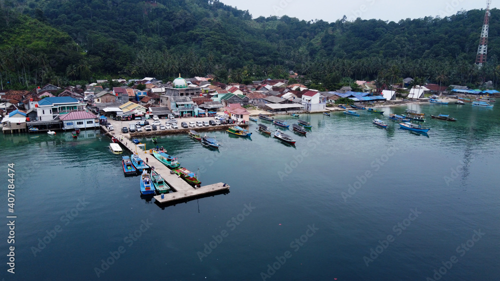 Pier with at Lampung Sea Pahawang Beach, located near the Sumatera city aerial drone. Resort Pahawang With a clouds on the Sky in a day. 