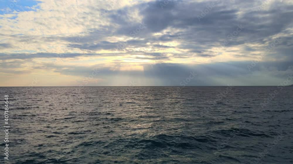 flying over ocean surface at sunset, drone point of view of the sea with dramatic sky, fast flight over water, holiday, travel concept flying over ocean surface at sunset, drone point of view of the sea with dramatic sky, fast flight over water, holiday, travel concept