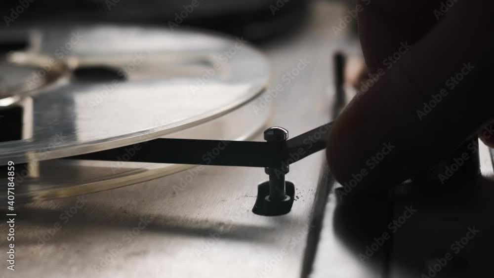 Old fashion vintage reel tape recorder. Man turn on and turn off reel-to-reel player.