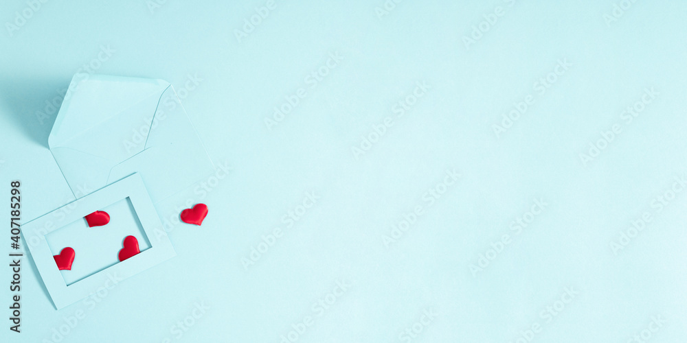 Creative minimal Valentine's Day concept. Envelopes, red hearts confetti, valentines on pastel blue background. Flat lay, top view, copy space Creative minimal Valentine's Day concept. Envelopes, red hearts confetti, valentines on pastel blue background. Flat lay, top view, copy space